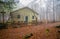 Isolated house in the beeches forest in Autumn.