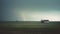 Isolated house in the farm field, with a distant thunderstorm and tornado approaching. Generative AI