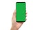 Isolated human left hand holding black mobile green screen smartphone