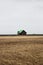 Isolated idyllic peaceful farm house building on grass meadow field on cloudy day in South Iceland Europe