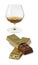 Isolated image of a glass with cognac and chocolate on a white background