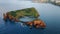 Isolated island seascape drone shot. Breathtaking rocky cape with sea lagoon