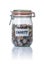 Isolated jar filled with coins labeled Charity