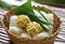 Isolated Ketupat Lebaran in rattan basket Eid celebratory dish of rice cake or Lebaran menu, Ketupat. Food Festive for Family in