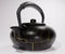 Isolated Kintsugi, black ceramic kettle teapot