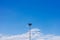 Isolated lamp post with blue sky.