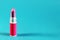 Isolated lipstick, Blue back ground, side view, free copy space