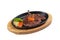 Isolated medium rare wagyu steak topping with mince carrot on hot plate and wooden plate served with potato salad