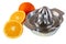 Isolated metallic juice squeezer and oranges