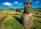 Isolated moai with horses in the background