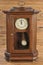 Isolated old-fashion wooden clock with pendulum