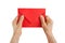 Isolated old wrinkled hands holding a red postal envelope letter. News concept