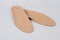 Isolated orthopedic insoles on a white background. Medical insoles. Foot care. Insole cutaway layers. Treatment and