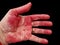 Isolated palm of womans hand stained red from cutting and working with raw beets