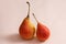 Isolated pears shot on a pastel pink background.
