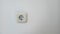 isolated photo electric plug on a white wall.