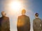 Isolated photo of Rear view of three business people looking at sun