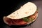 Isolated piadina on black background