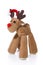 Isolated plush reindeer or elk with a santa or christmas hat for