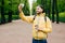 Isolated portrait of hipster guy wearing fashionable clothes resting in park alone admiring good weather and fresh air. Bearded ma