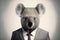 Isolated portrait of a koala bear in a man\\\'s body wearing a suit and tie