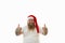 Isolated portrait on a white background of an overweigh man in Santa Claus hat signaling ok ,doing positive gesture with hands,