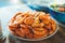 Isolated prepared orange shrimp on background table on kitchen, closeup of fresh prawn products in restaurant