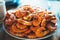 Isolated prepared orange shrimp on background table on kitchen, closeup of fresh prawn products in restaurant, shellfish sea food