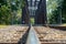 Isolated rail on vintage railway trestle crossing the river