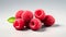 Isolated raspberries on a sophisticated gray background.