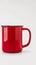 Isolated red mug in striking close up on white background