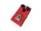 Isolated red texture overdrive stompbox electric guitar effect for studio and stage performed on white background