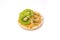 Isolated rice cake with peanut butter with slice of kiwi and seeds on white background