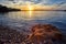 Isolated Rock With Sunset Sky Seascape View At The Alcudia Bay