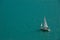 Isolated Sailboat On A Blue Lake Background