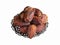 Isolated Saudi dates fruits in a bowl. Top view