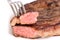 Isolated served piece of medium grilled beef steak on white background