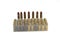 Isolated shot of nine caliber cartridge of military war pistol on a white background