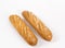 Isolated shot of the pieces of Baguette bread on a white background