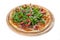 Isolated shot of a pizza with ham and arugula - perfect for a food blog or menu usage