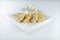 Isolated shot of a white plate with delicious quesadilla with white sauce - perfect for menu usage