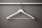 Isolated shot of wooden coat hanger for hanging clothes. Generative AI