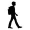 Isolated silhouette of a boy going with a backpack to school