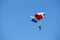 Isolated skydiver control colorful parachute gliding after free