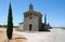 An isolated small Catholic Church with bell tower and mounted crucifix in the Drome area of South East France.