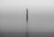 Isolated smokestack in the fog