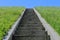 Isolated stairs, green grass, blue sky