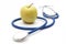 Isolated Stethoscope With Green Apple