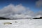 Isolated stone in a snowy landscape in Pyrenees