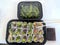 Isolated sushi box with assorted sushi pieces, ginger, soy sauce, and edamame